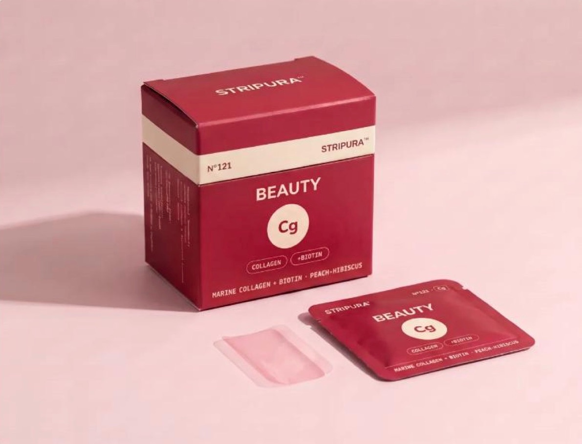 Stripura Beauty collagen box in deep red with its pouch and a pale pink strip
